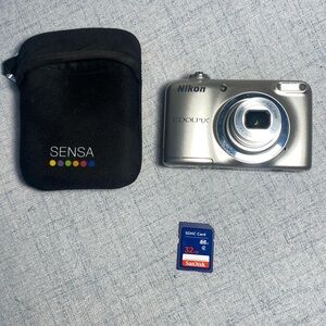 Nikon Coolpix Silver Digital Camera plus 32 gig memory card and carry case